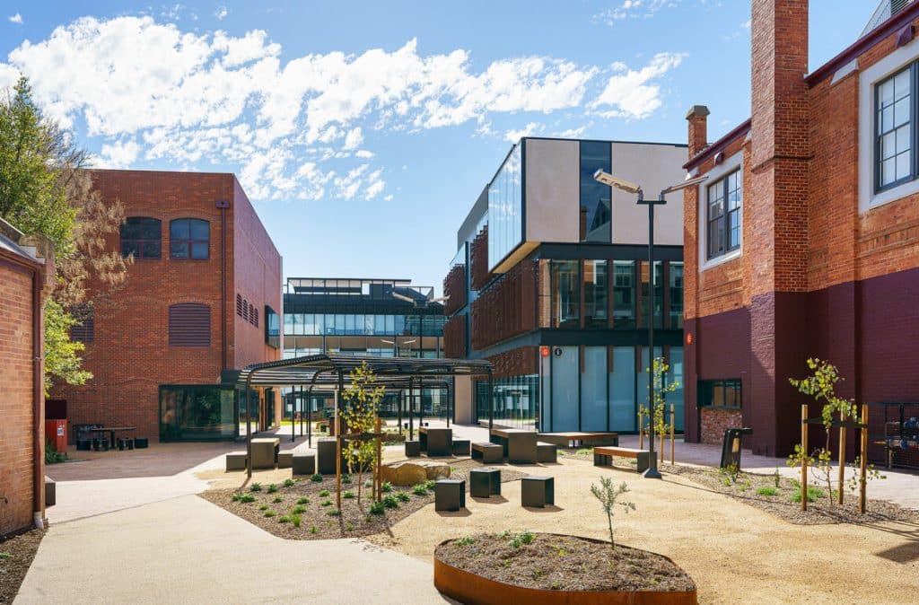 Exterior view of Bendigo TAFE’s revitalised city campus featuring a blend of modern architecture and restored heritage buildings.