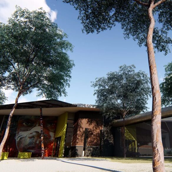 Contemporary building with yellow outdoor seating and landscaped green space.